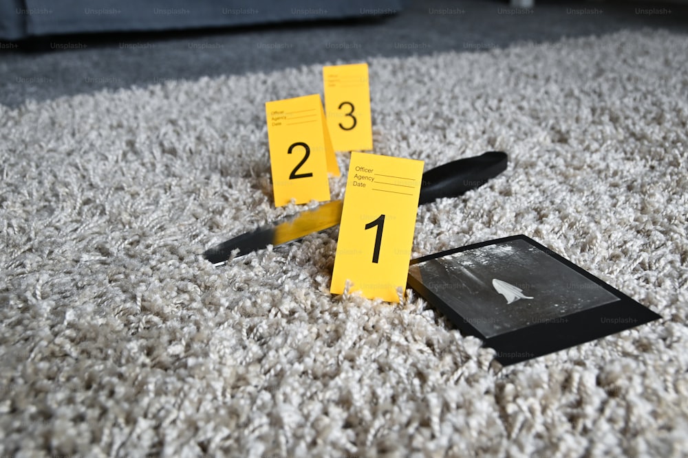 a pile of sticky notes sitting on top of a carpet