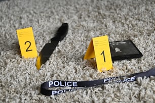 a police badge and a pair of scissors on a carpet