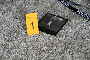 a black and white photo of a police badge on a carpet