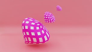 a pink object with white squares on a pink background