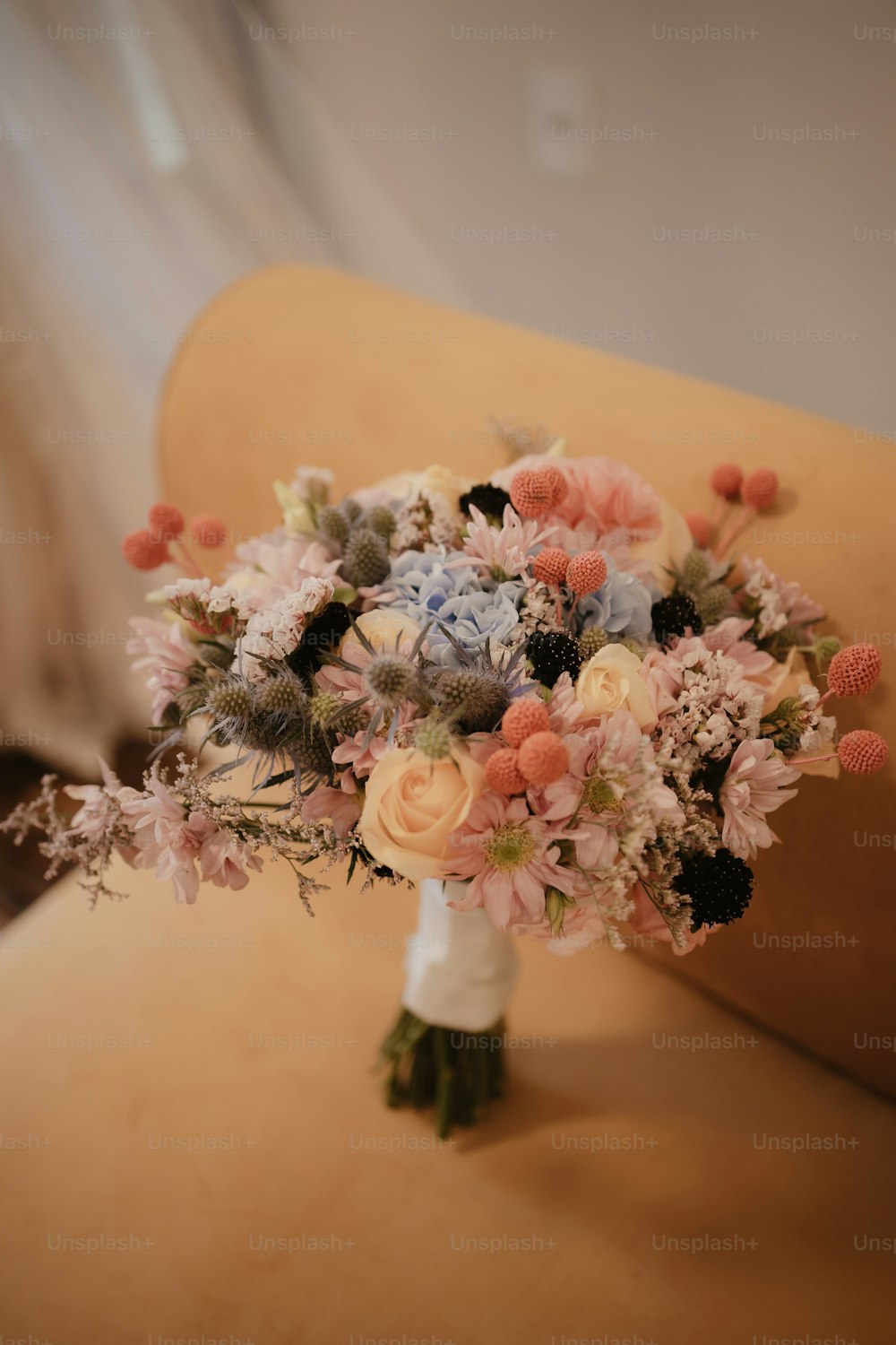 a bouquet of flowers sitting on top of a chair