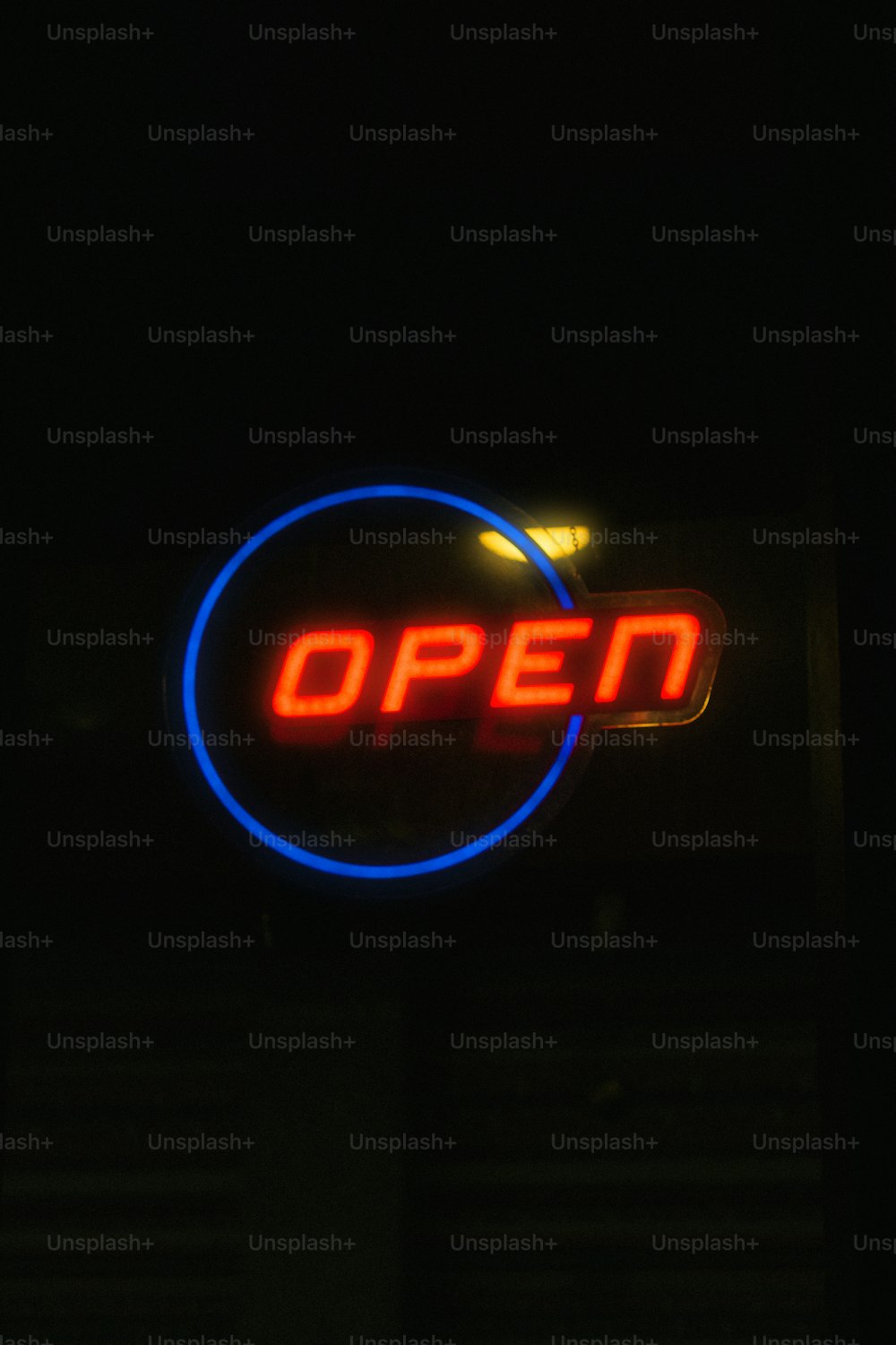 an open sign lit up in the dark