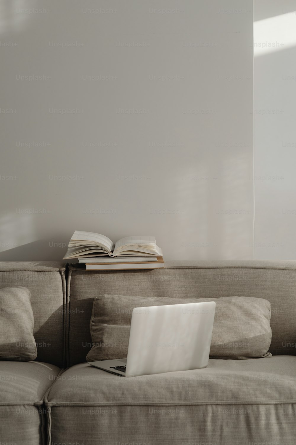 a laptop computer sitting on top of a couch