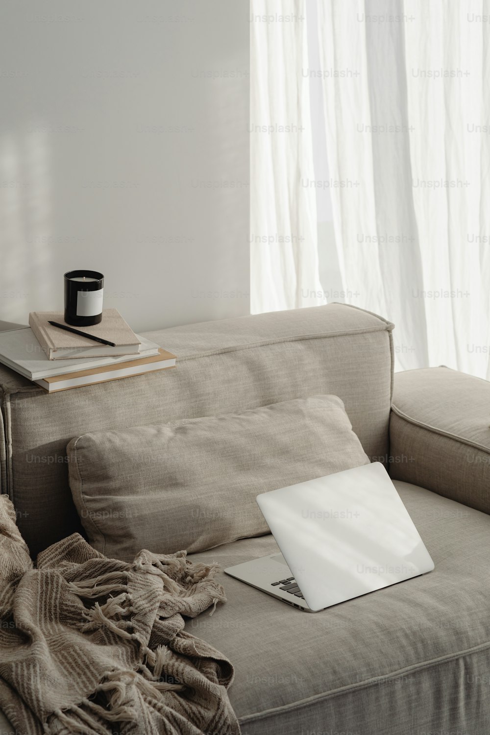 a laptop computer sitting on top of a couch