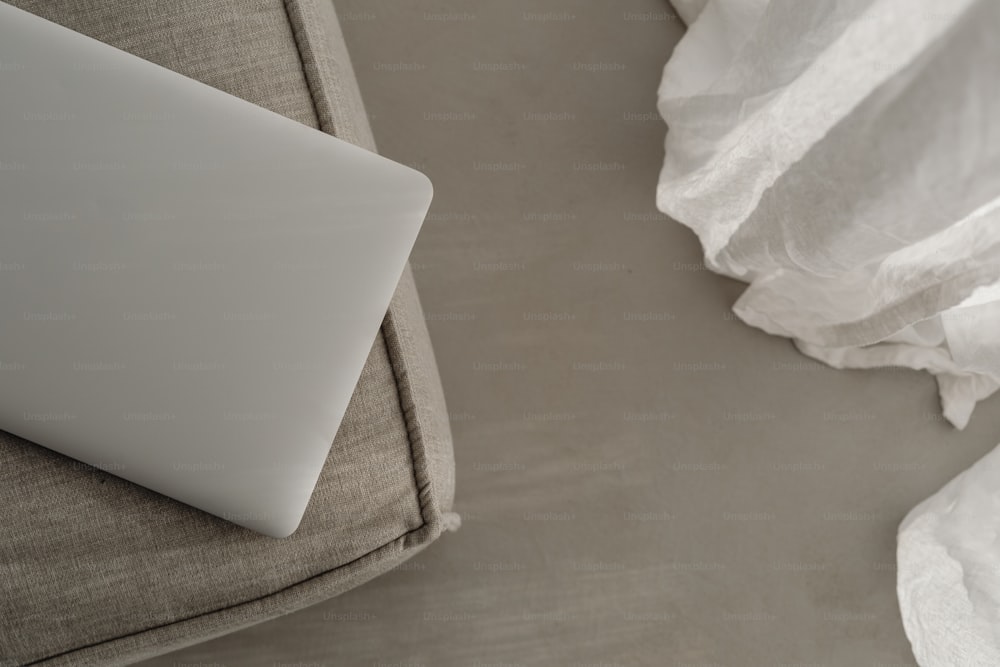 a laptop computer sitting on top of a couch