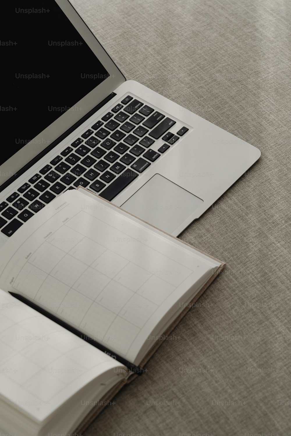 a laptop computer sitting on top of a table