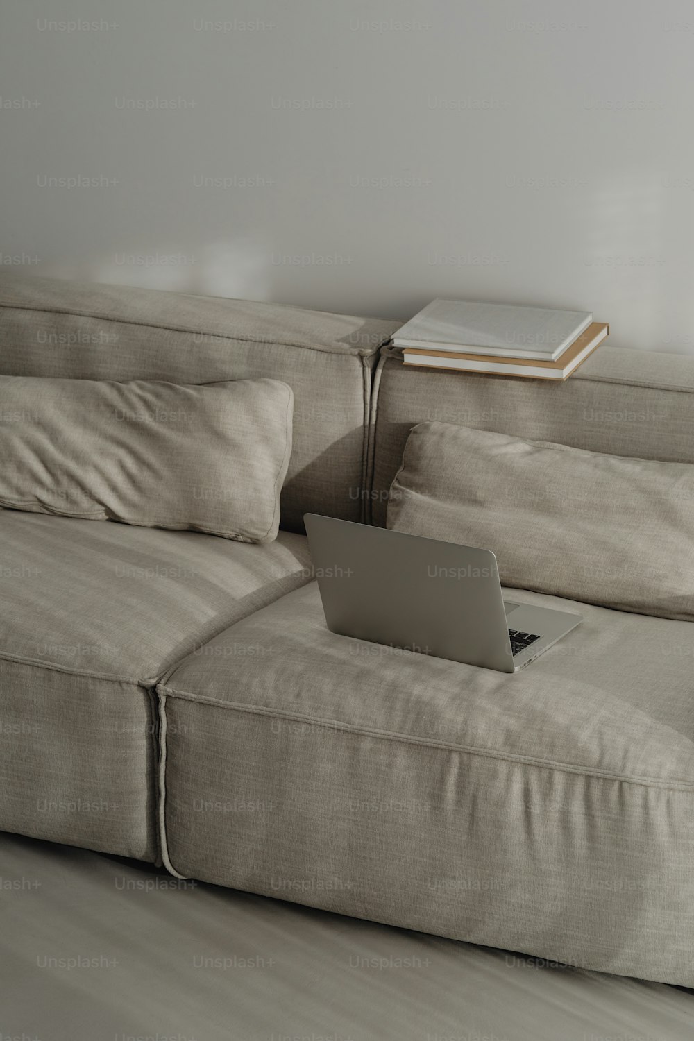 a laptop computer sitting on top of a couch