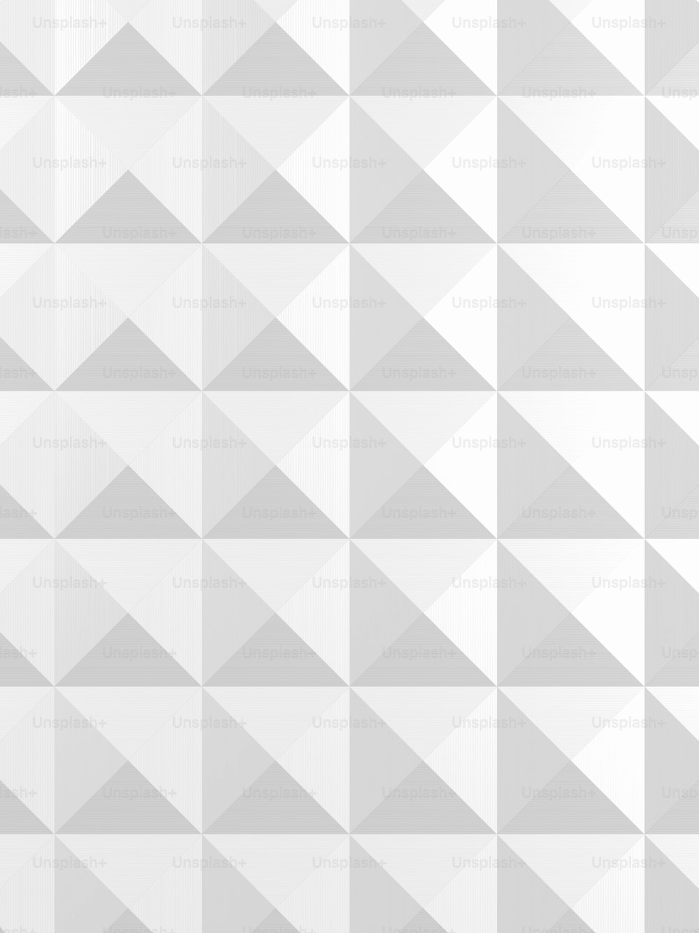 ein weißer Hintergrund mit einem Muster von Dreiecken