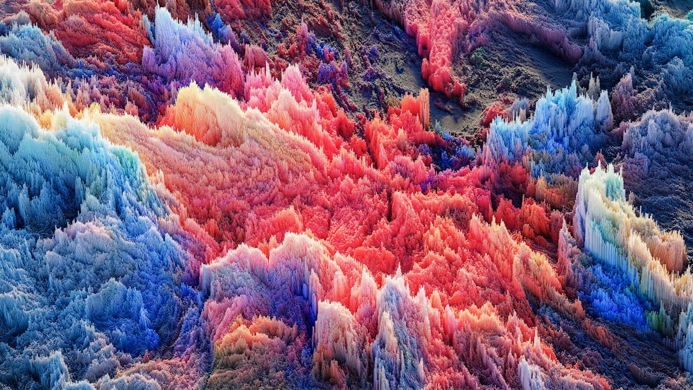 an aerial view of a multicolored mountain