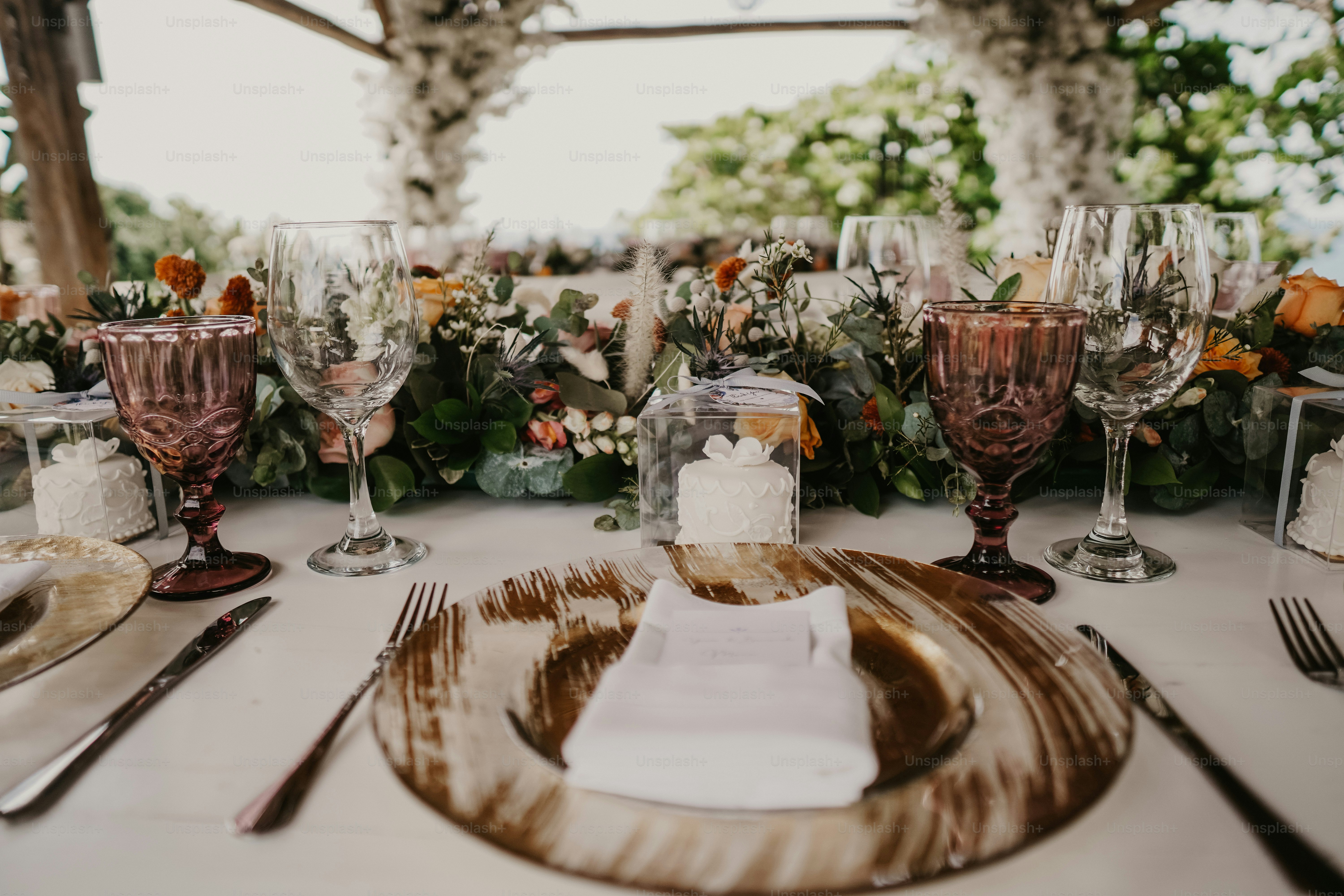 Elegant gold wedding silverware arranged on a formal reception table