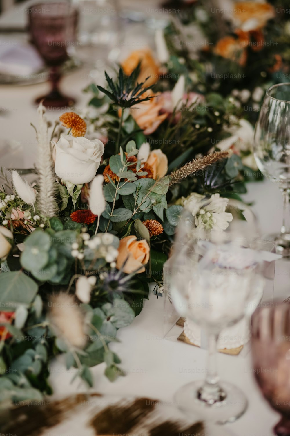 a close up of a table with a bunch of flowers on it