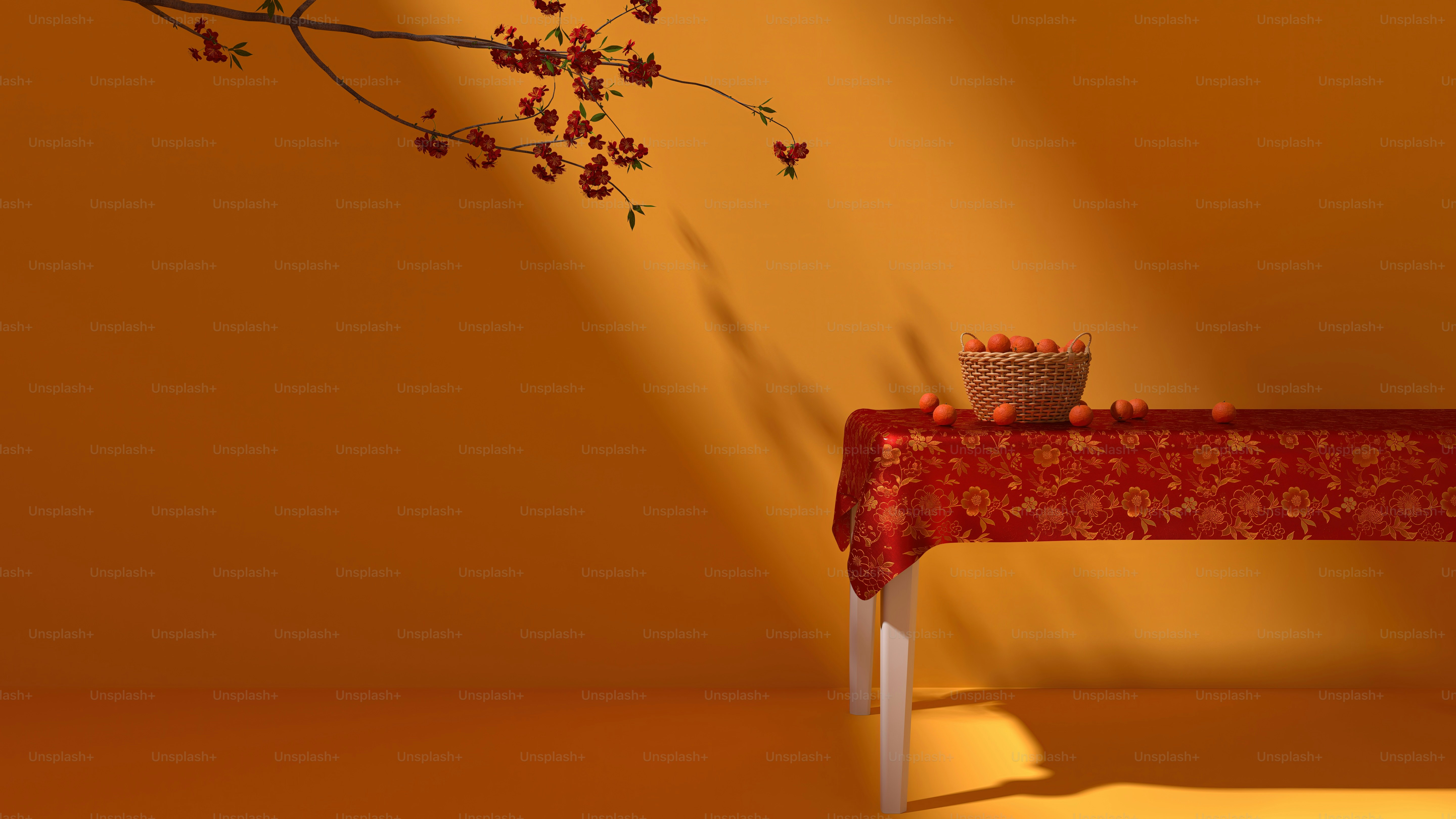 a table with a red table cloth and a vase with flowers on it