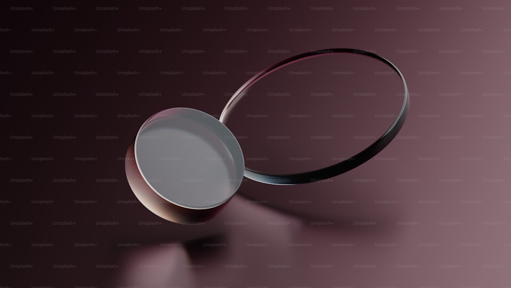 un objet rond est représenté sur une surface violette