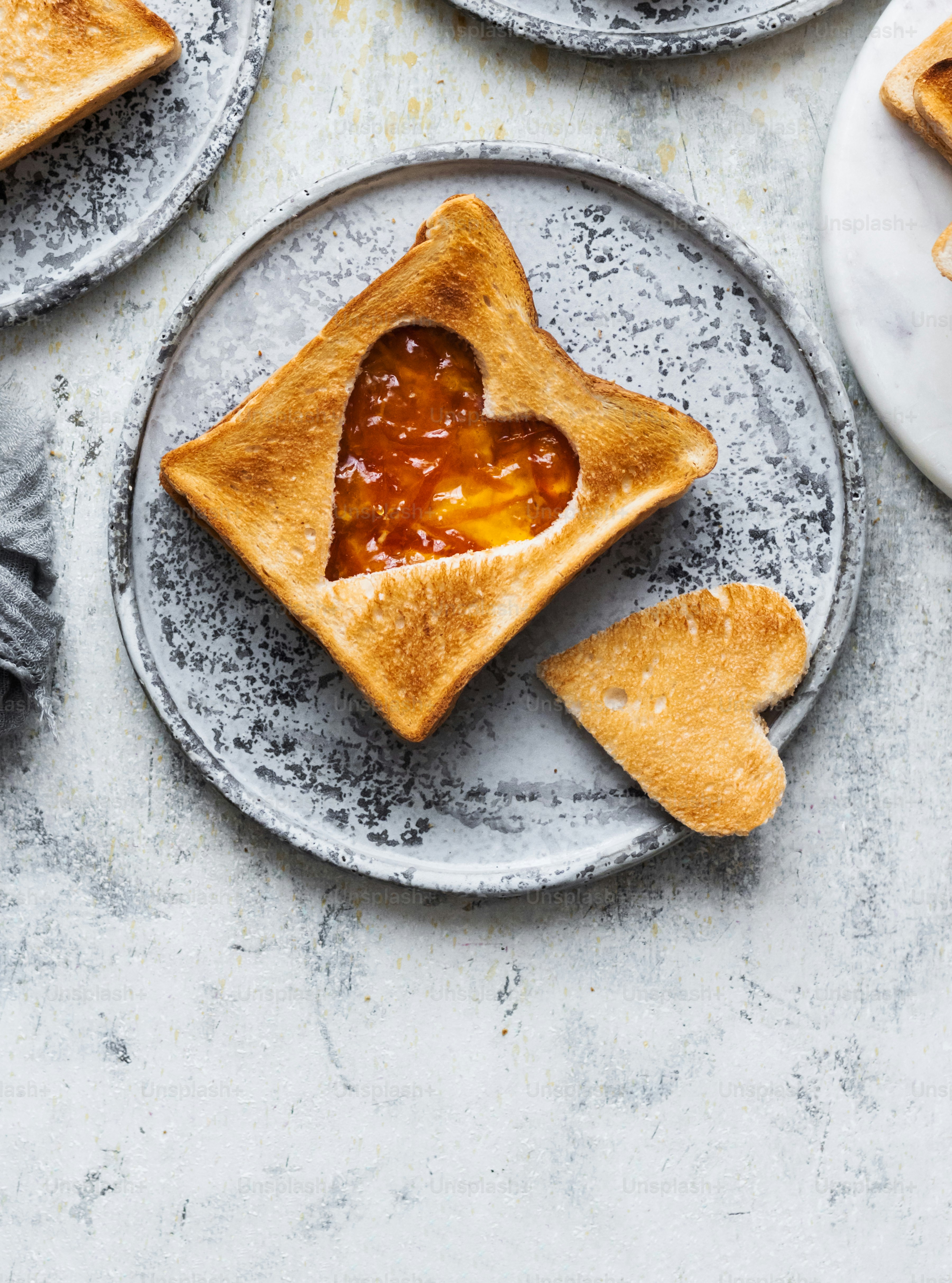 a heart shaped piece of bread on a plate