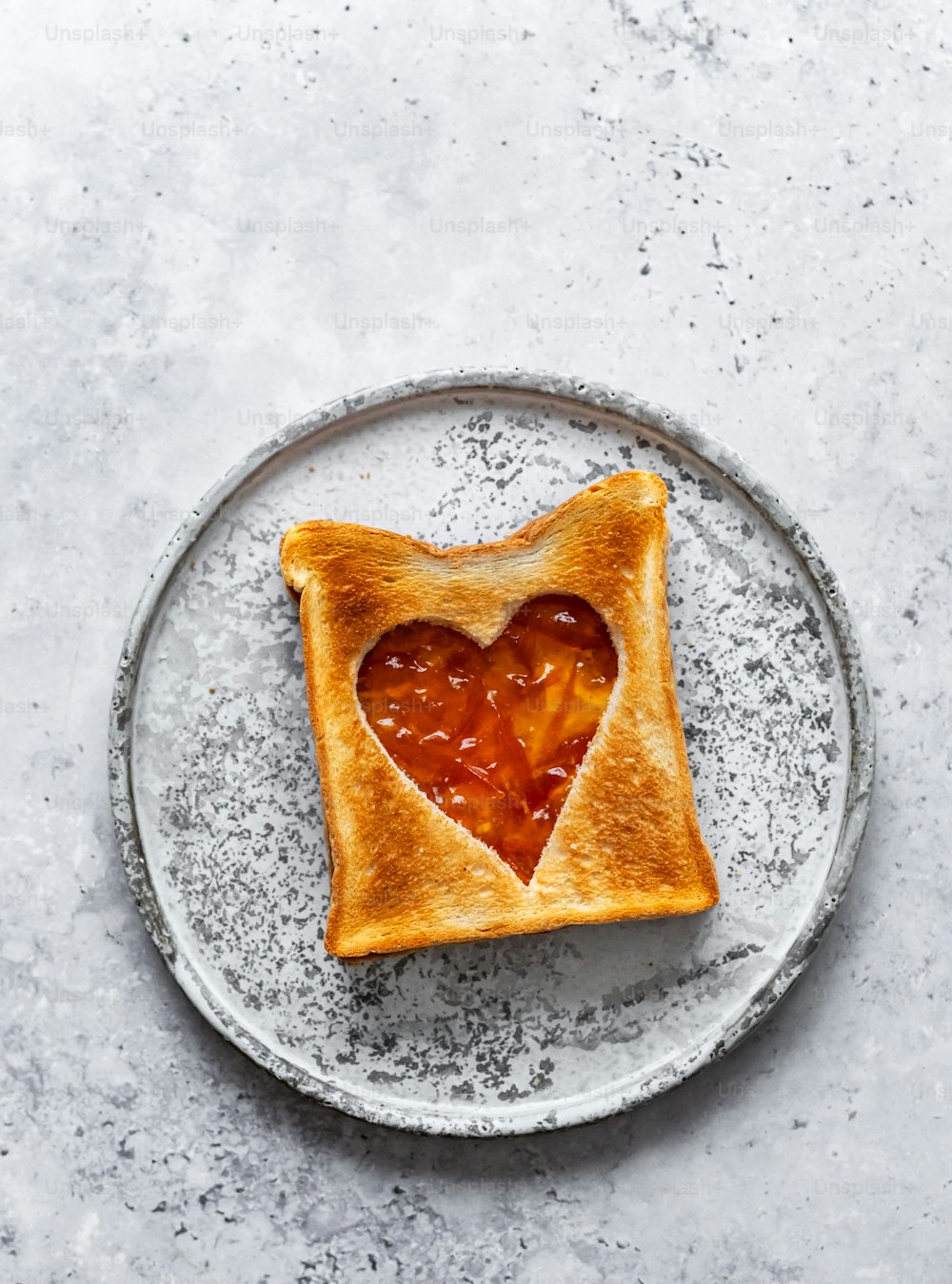 a heart shaped toast on a plate