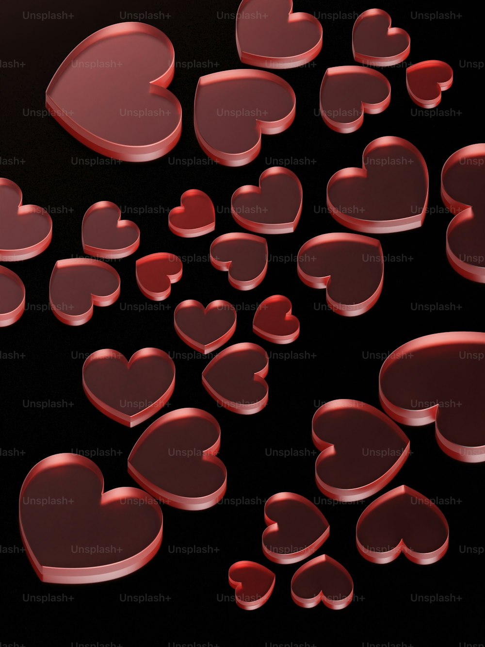 a bunch of red hearts on a black background