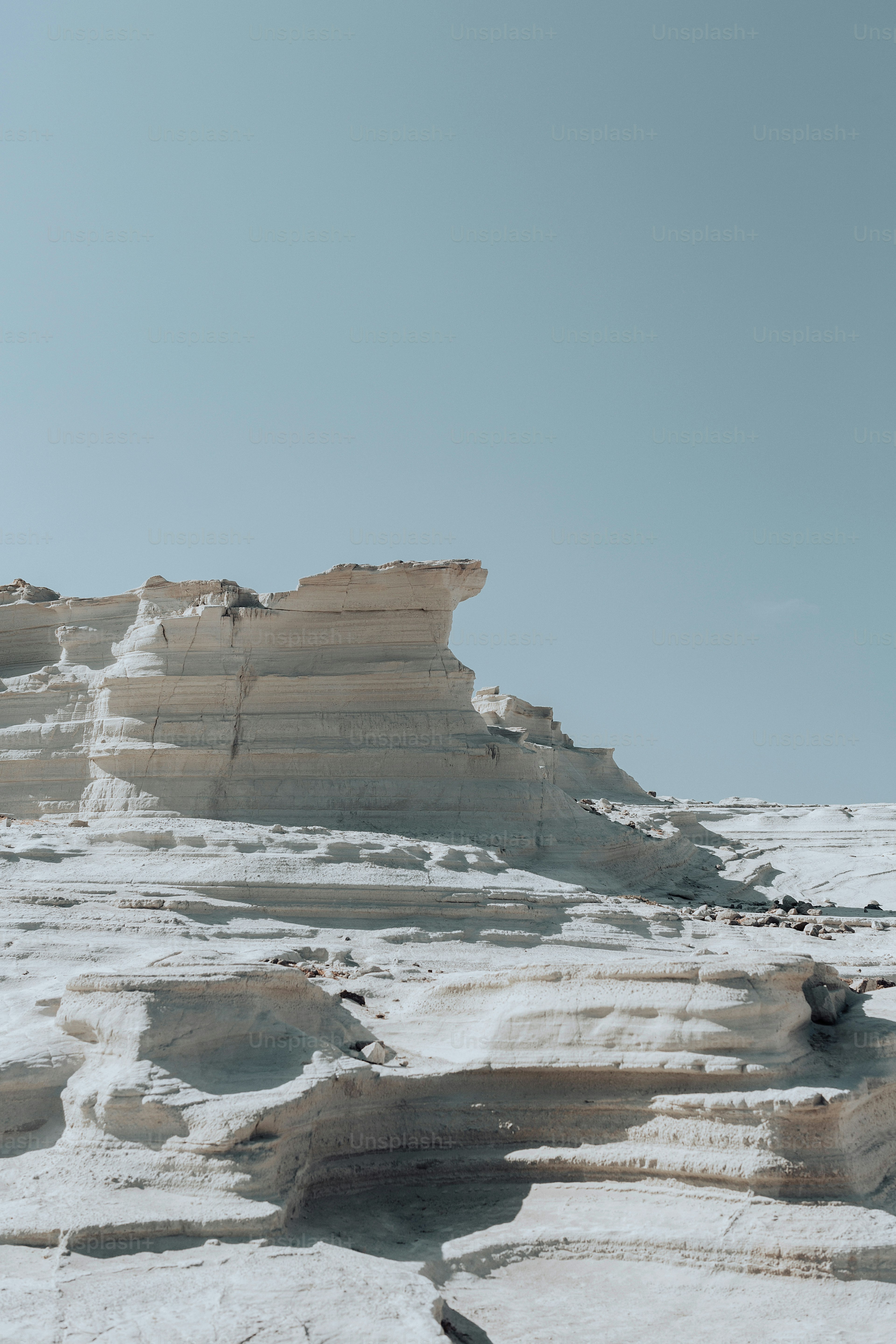 a person standing on top of a snow covered mountain