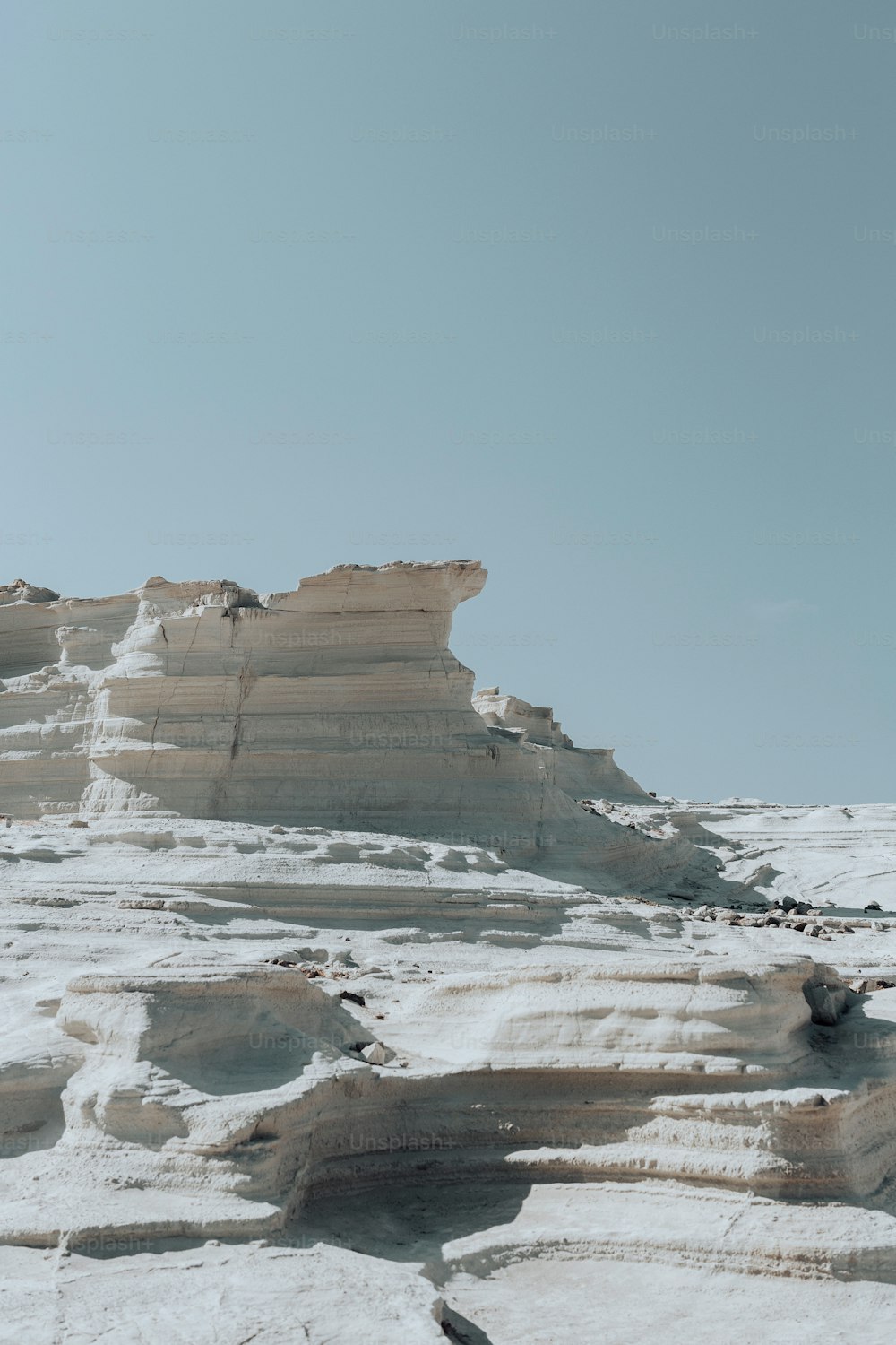 a person standing on top of a snow covered mountain