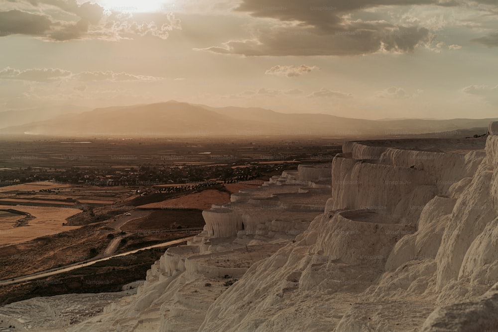 a man riding a horse on top of a mountain