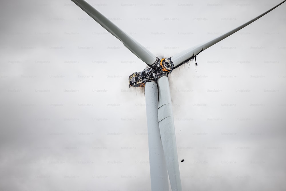 a group of people working on a wind turbine