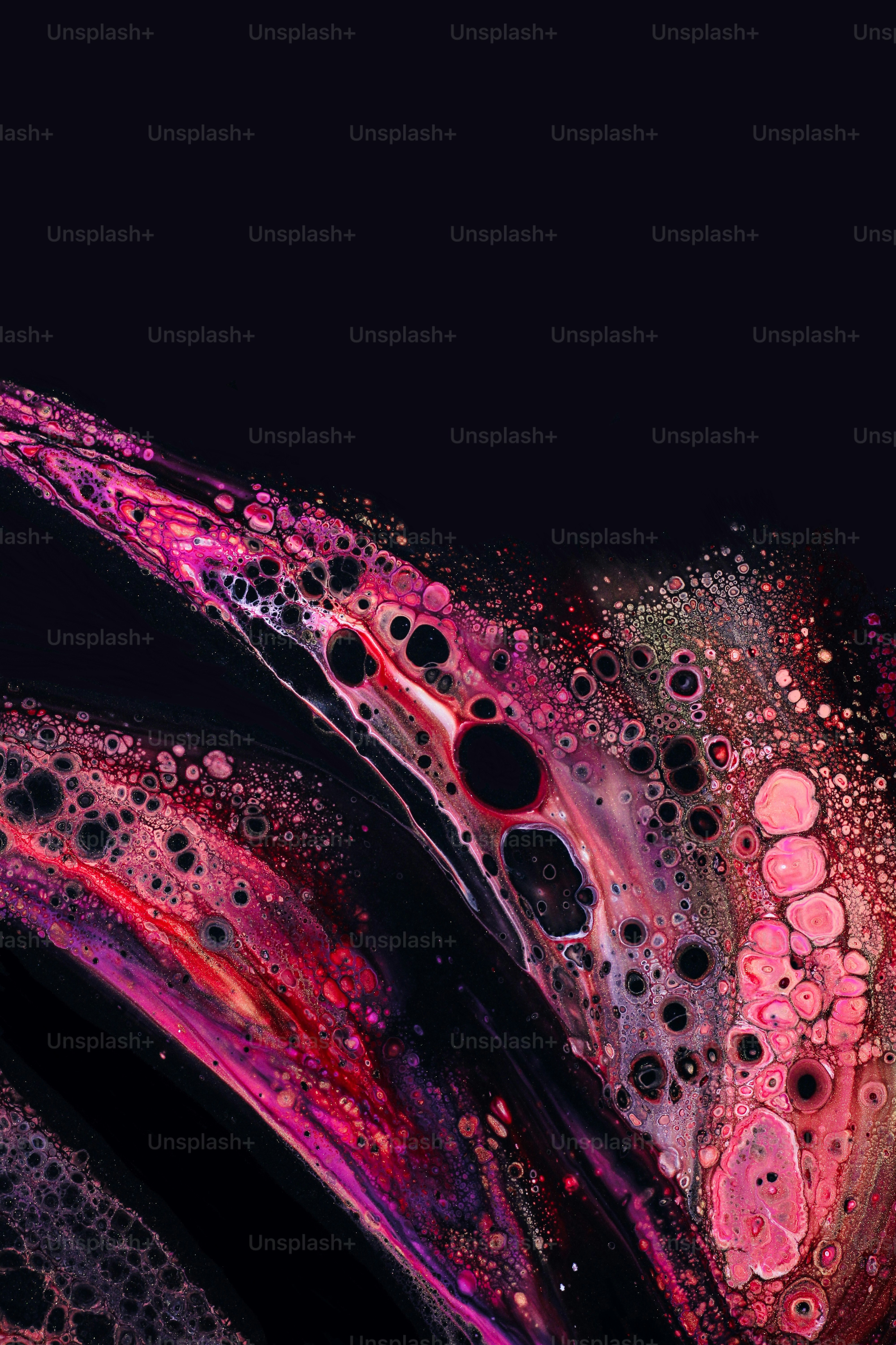 a close up of a cell phone with water droplets on it