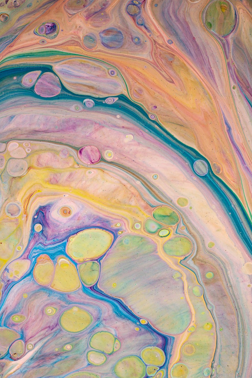 an abstract painting with multicolored paint and bubbles