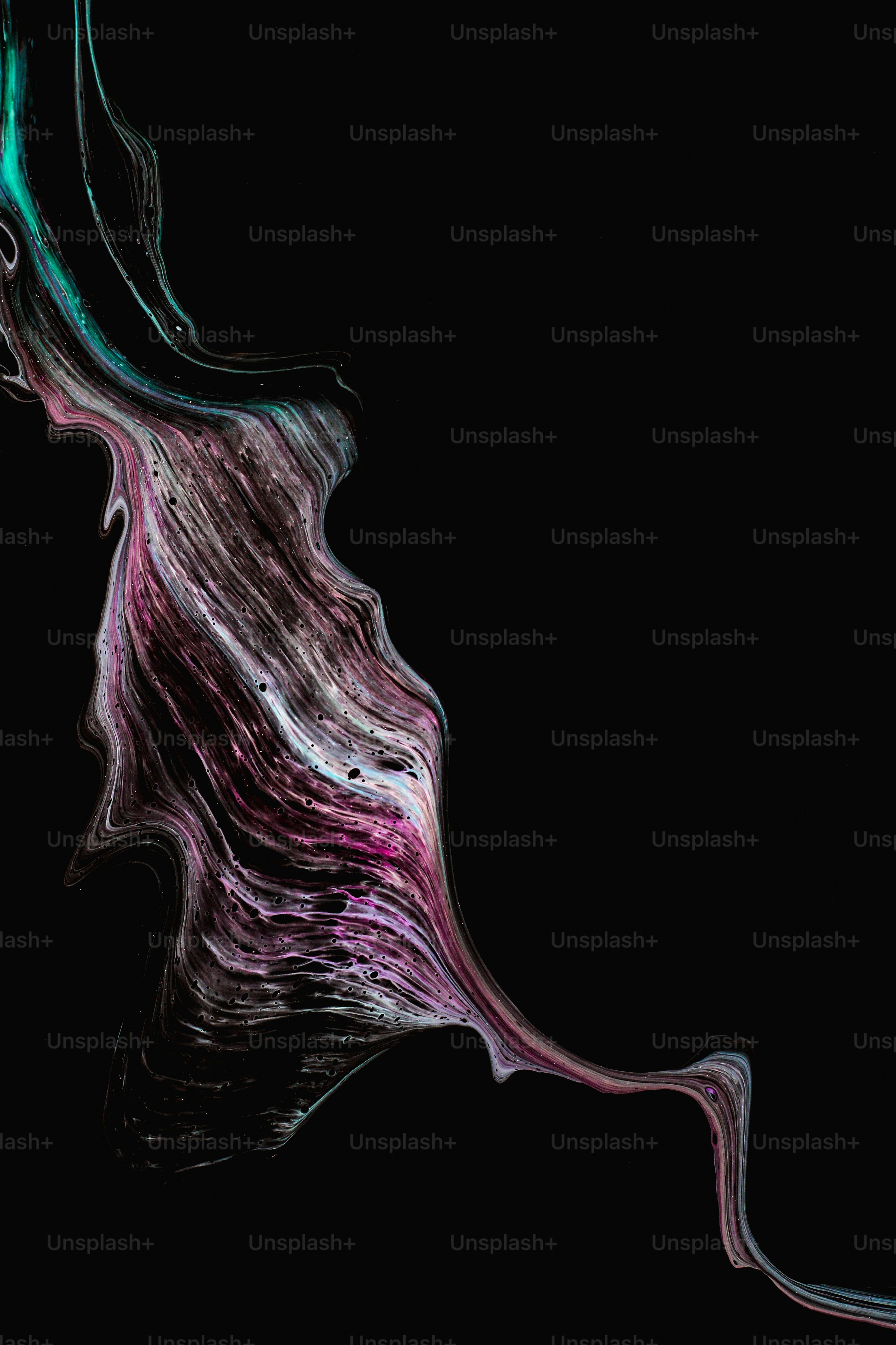 a black background with a purple and green swirl