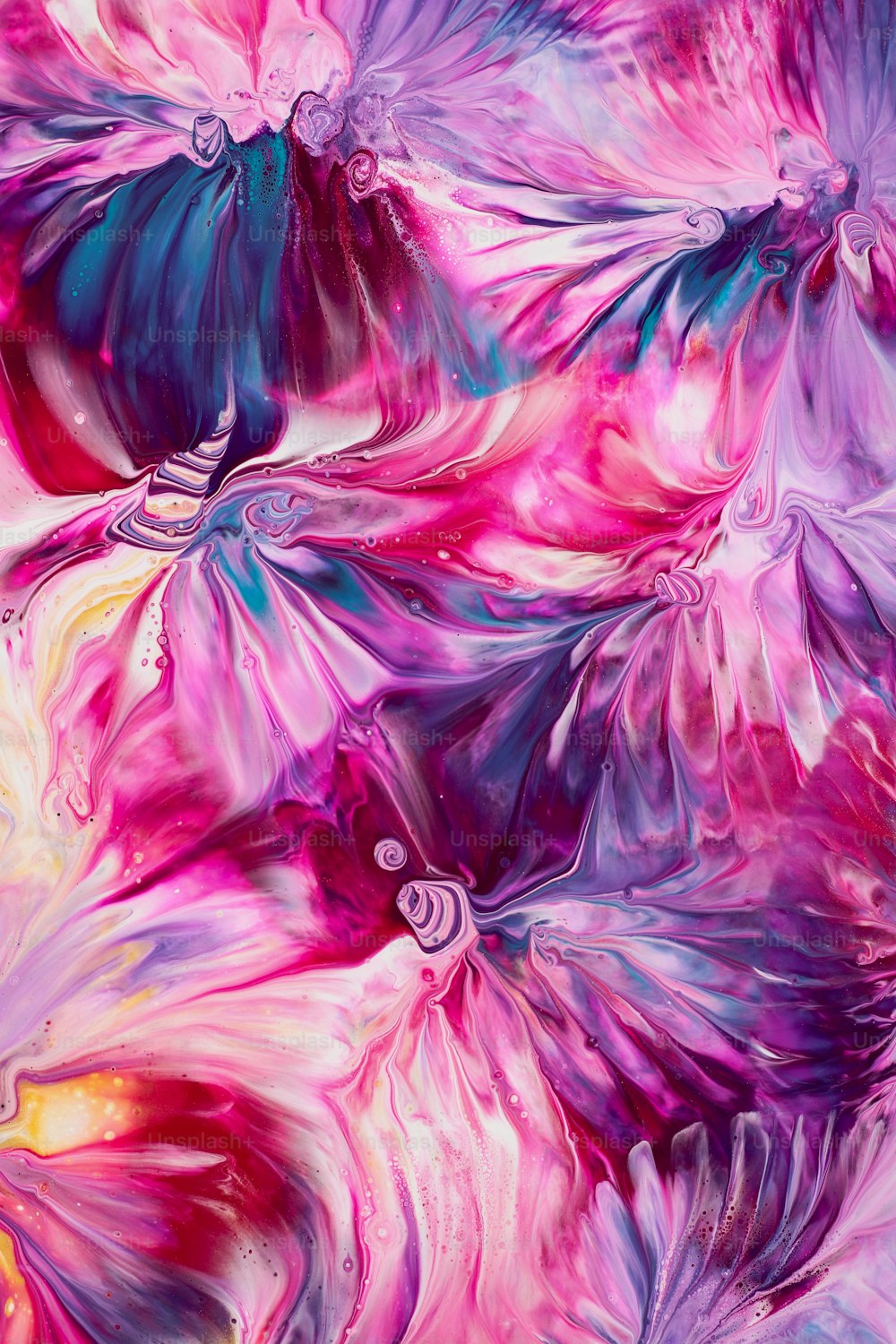 an abstract painting of pink and blue flowers