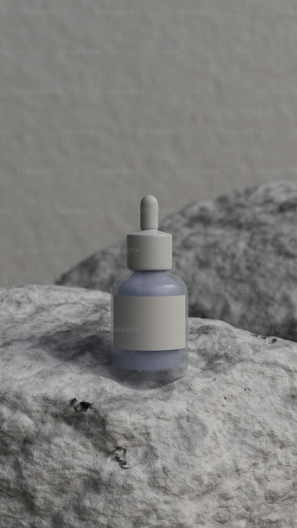 a small bottle sitting on top of a rock