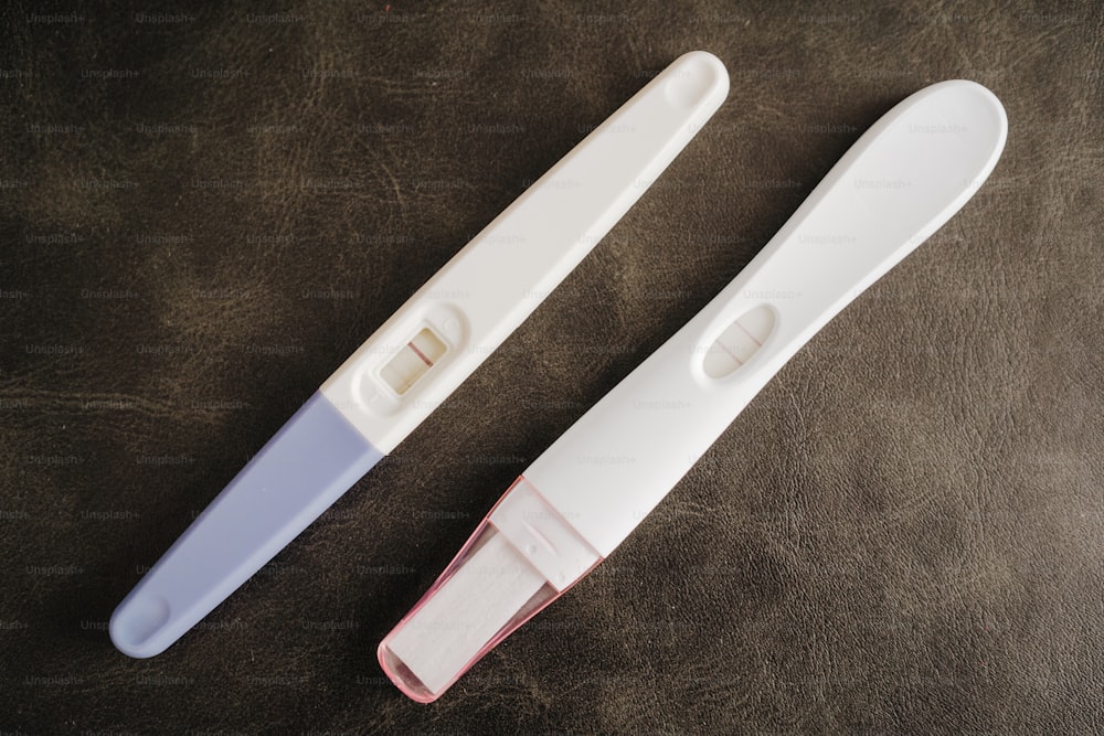 a couple of toothbrushes sitting on top of a table