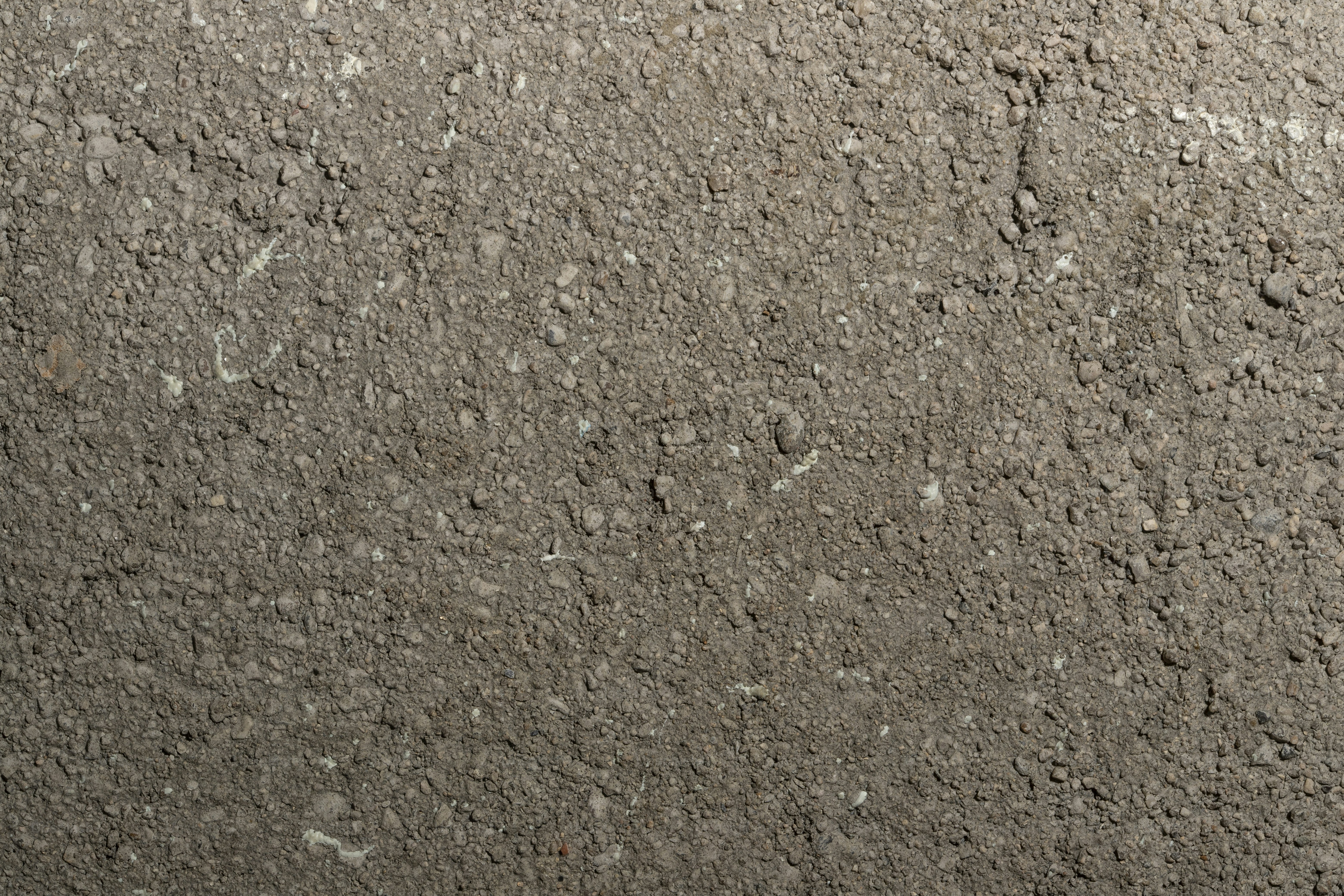 Nahaufnahme einer Schmutzfläche mit kleinen Steinen