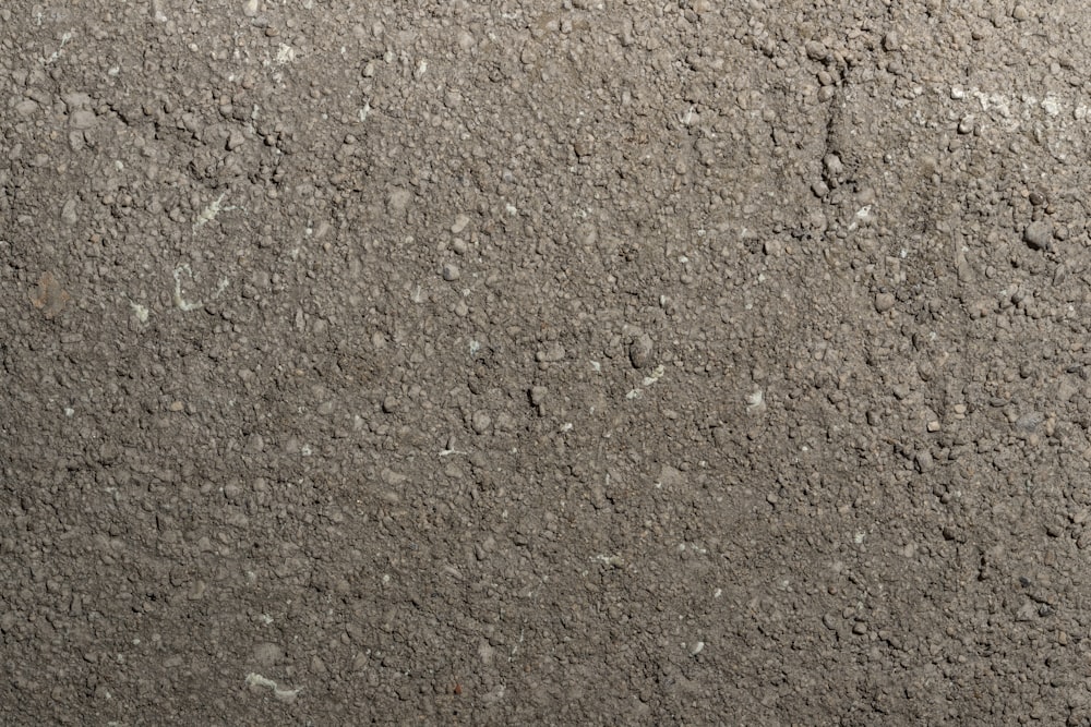 a close up of a dirt surface with small rocks