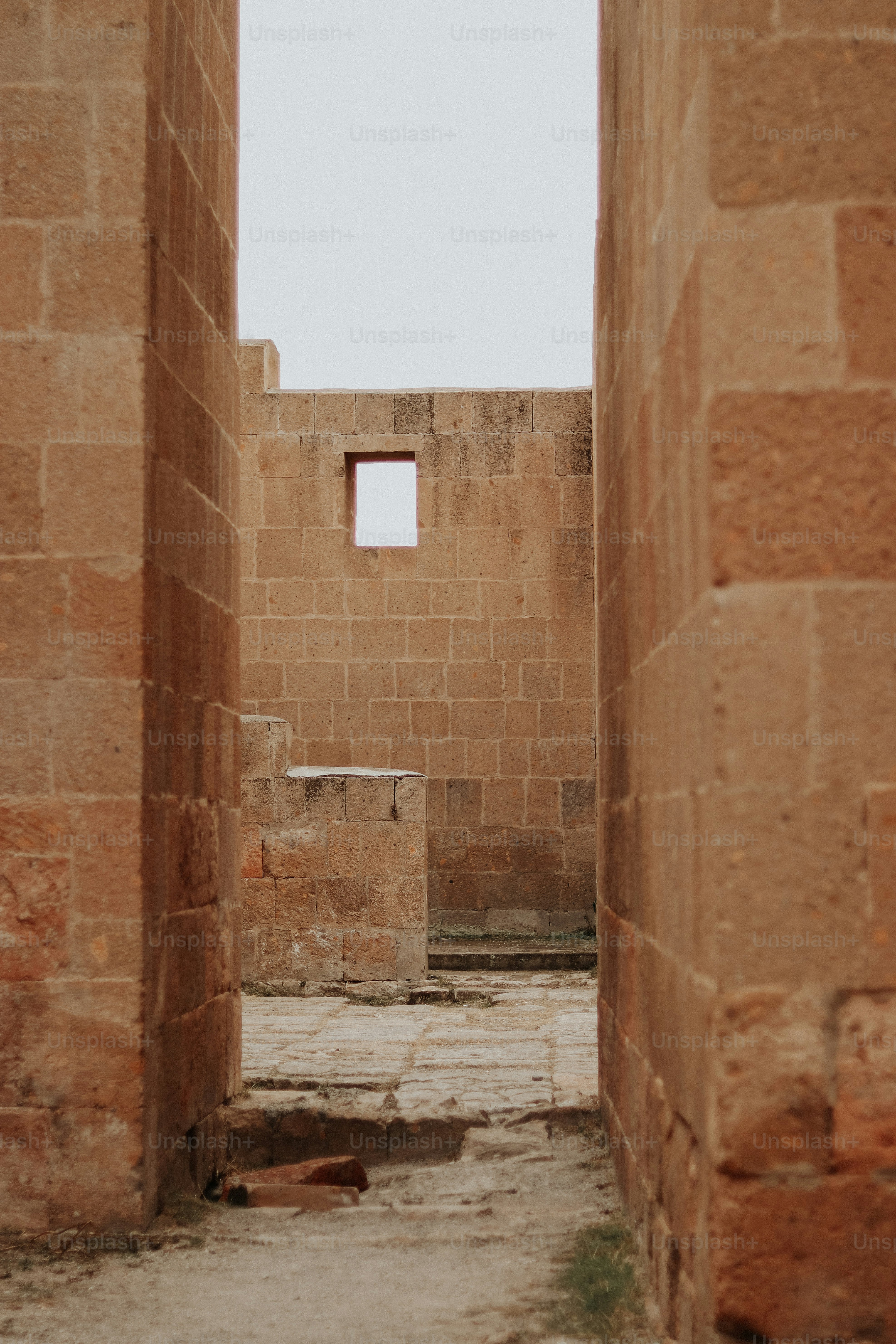 a stone building with a small window in the middle of it