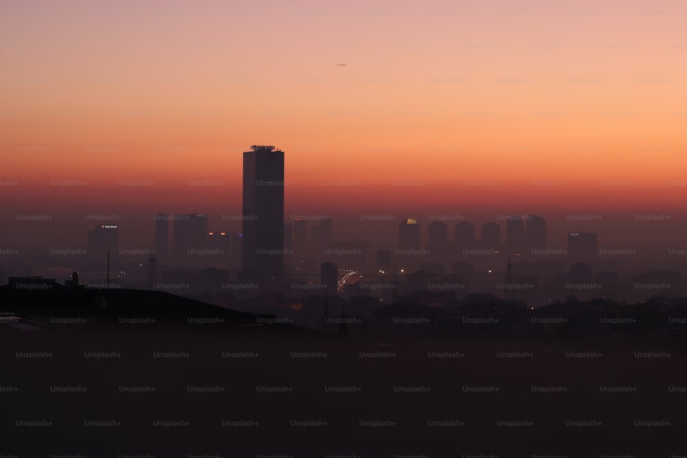 a view of a city skyline at sunset