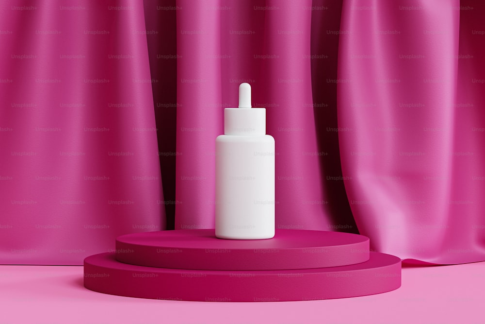 a white bottle sitting on top of a pink stand