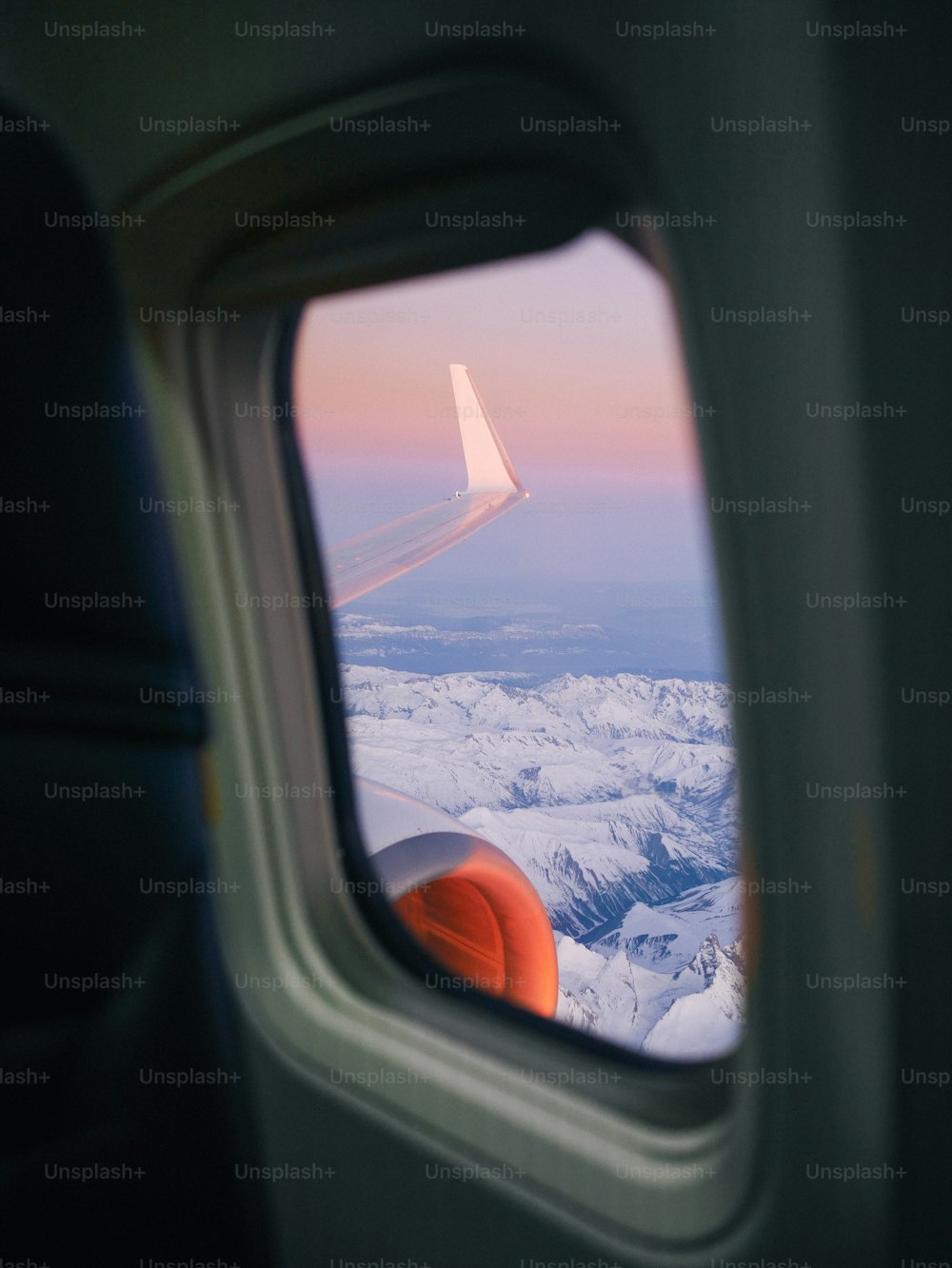 a view of the wing of an airplane through a window