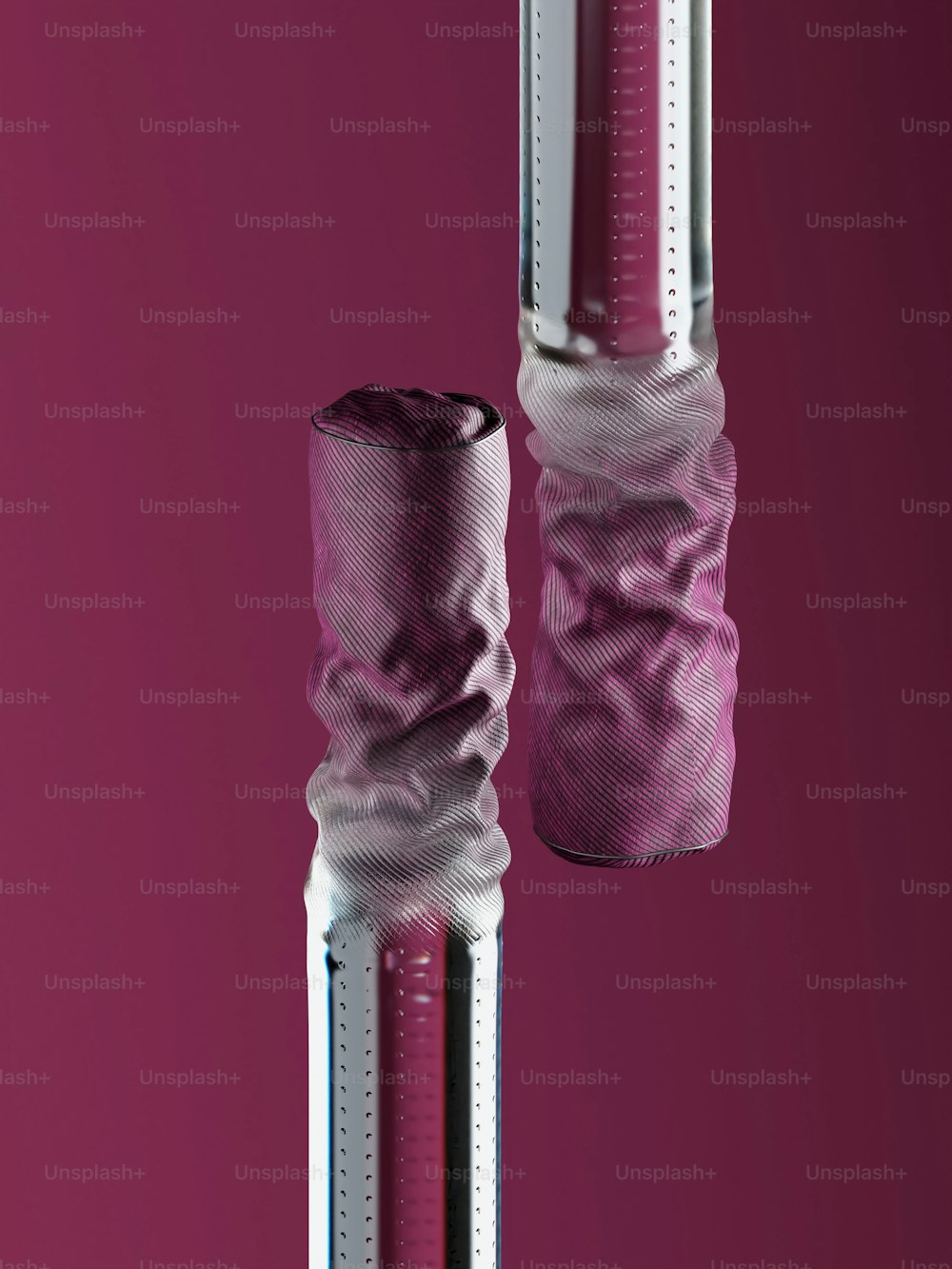 a pair of pink and white poles on a pink background