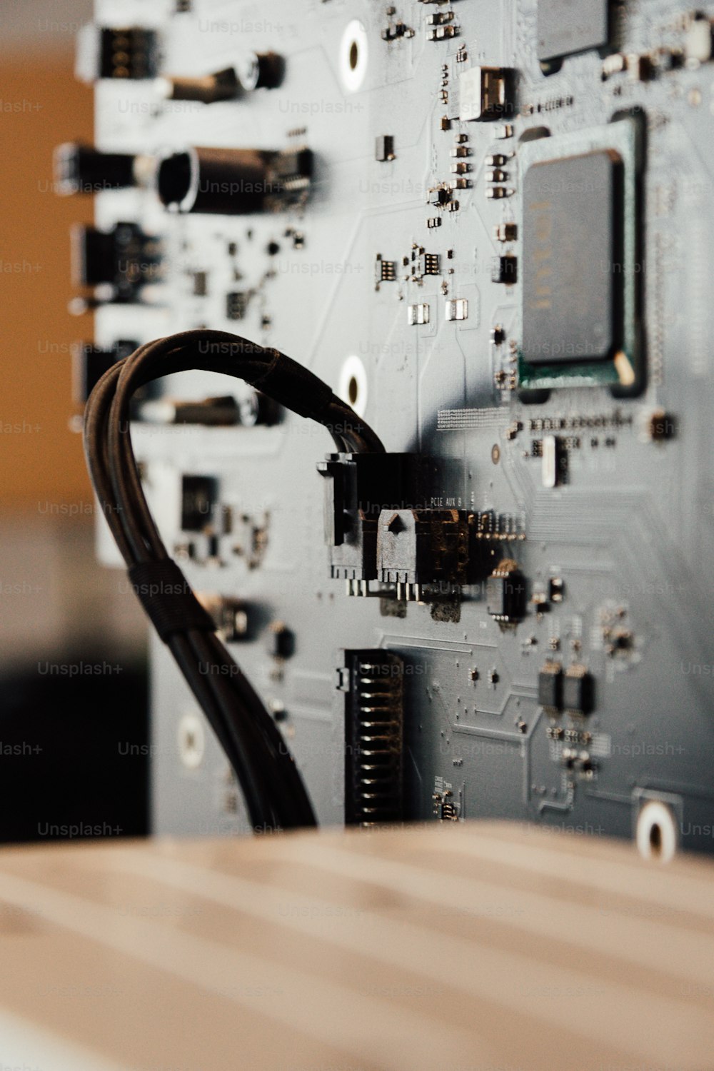 a close up of a computer motherboard with wires