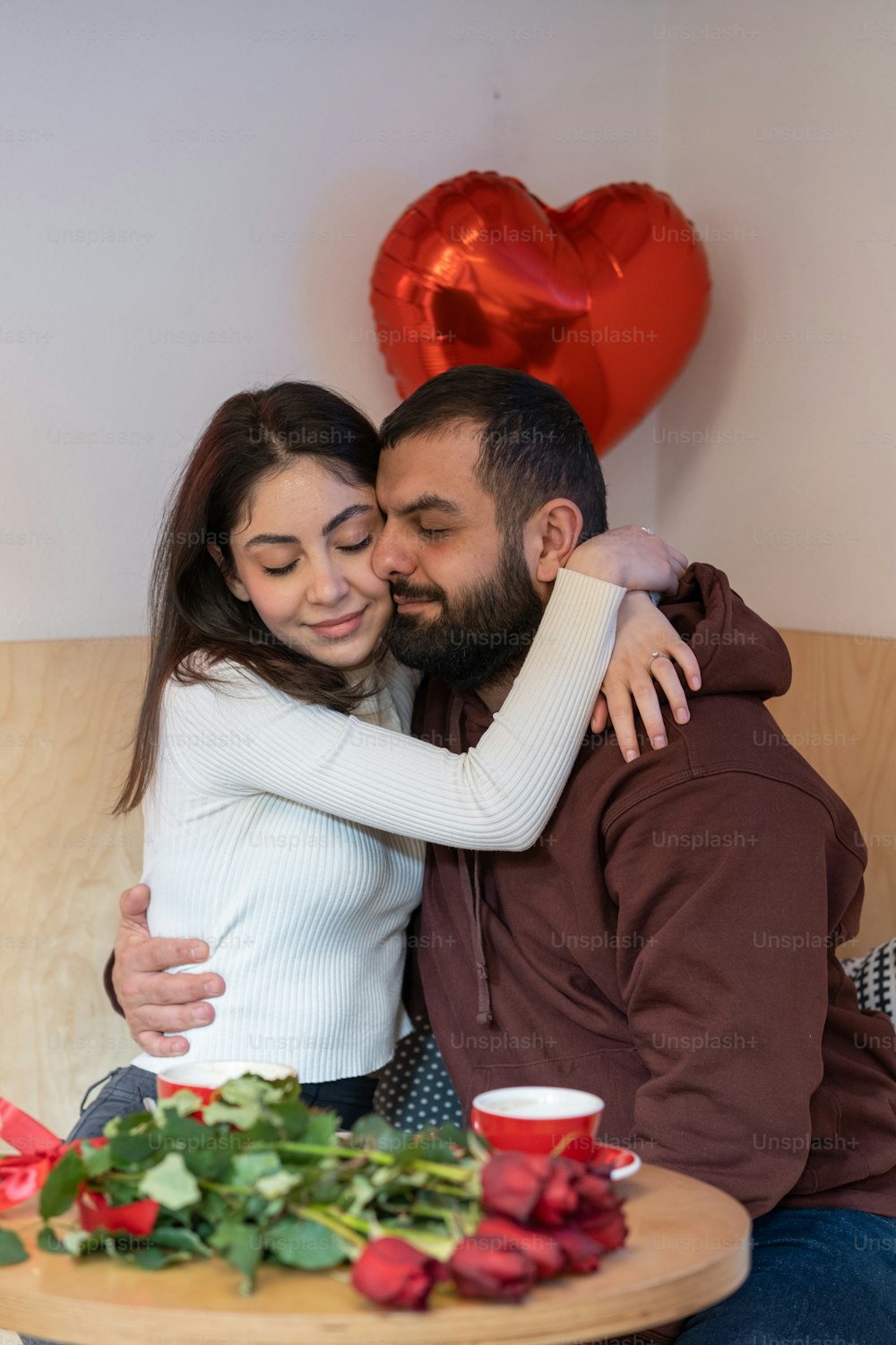 a man and a woman sitting next to each other