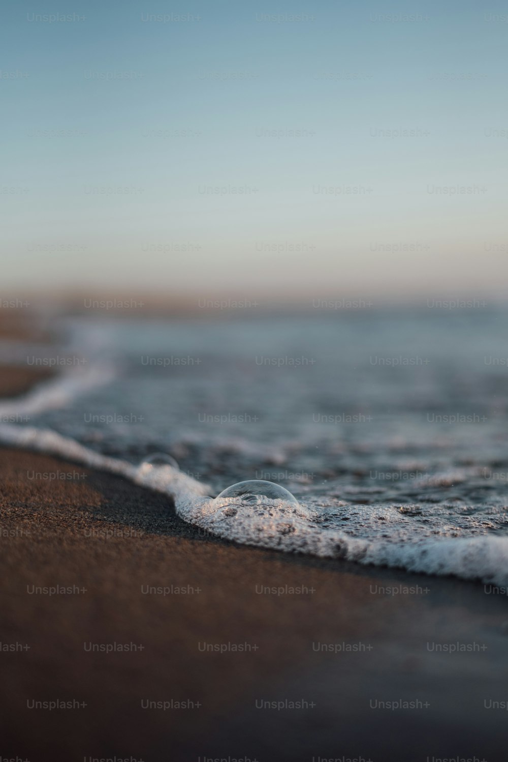 a close up of a wave coming in to the shore