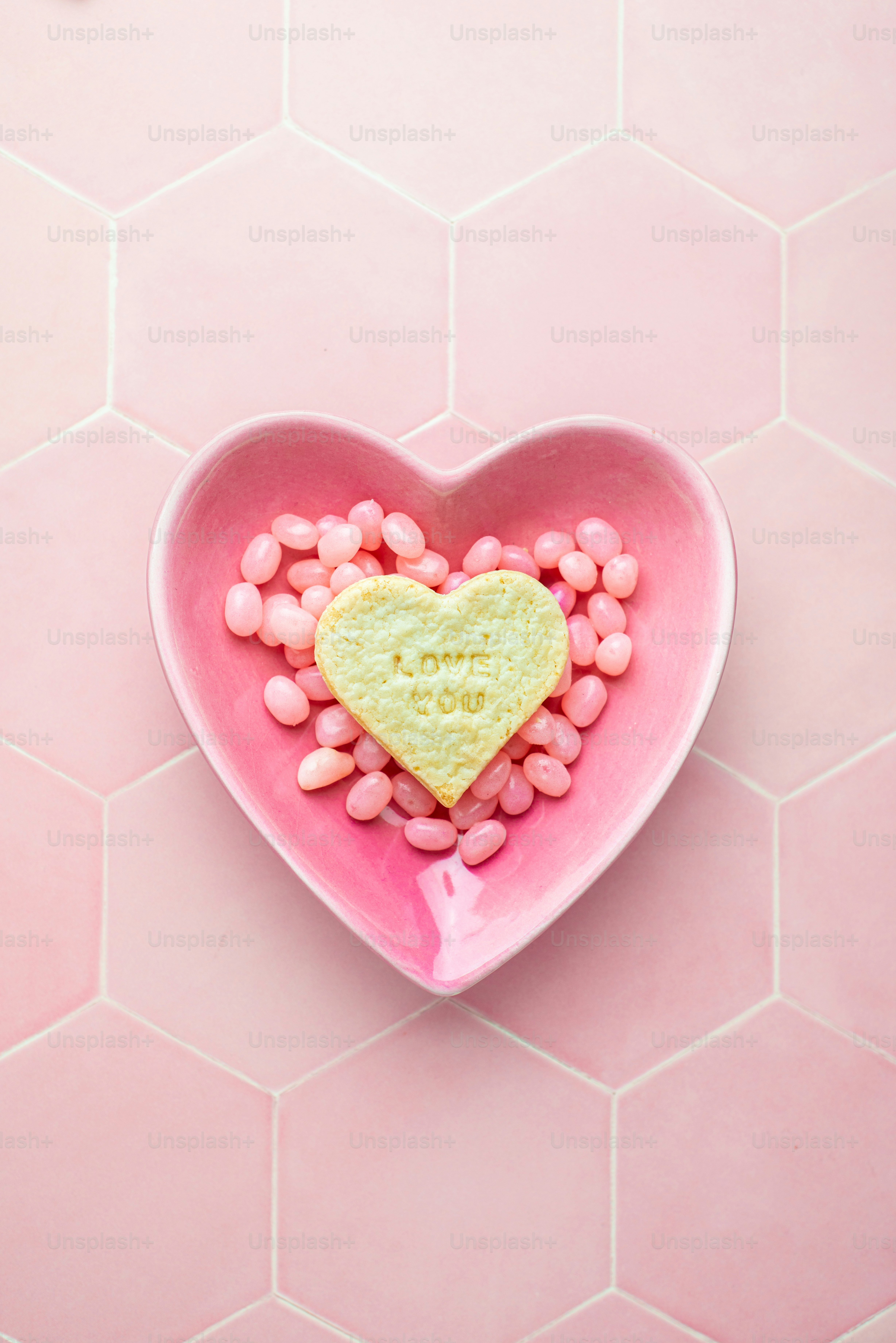 A heart shaped bowl filled with pink candy photo Love heart Image on