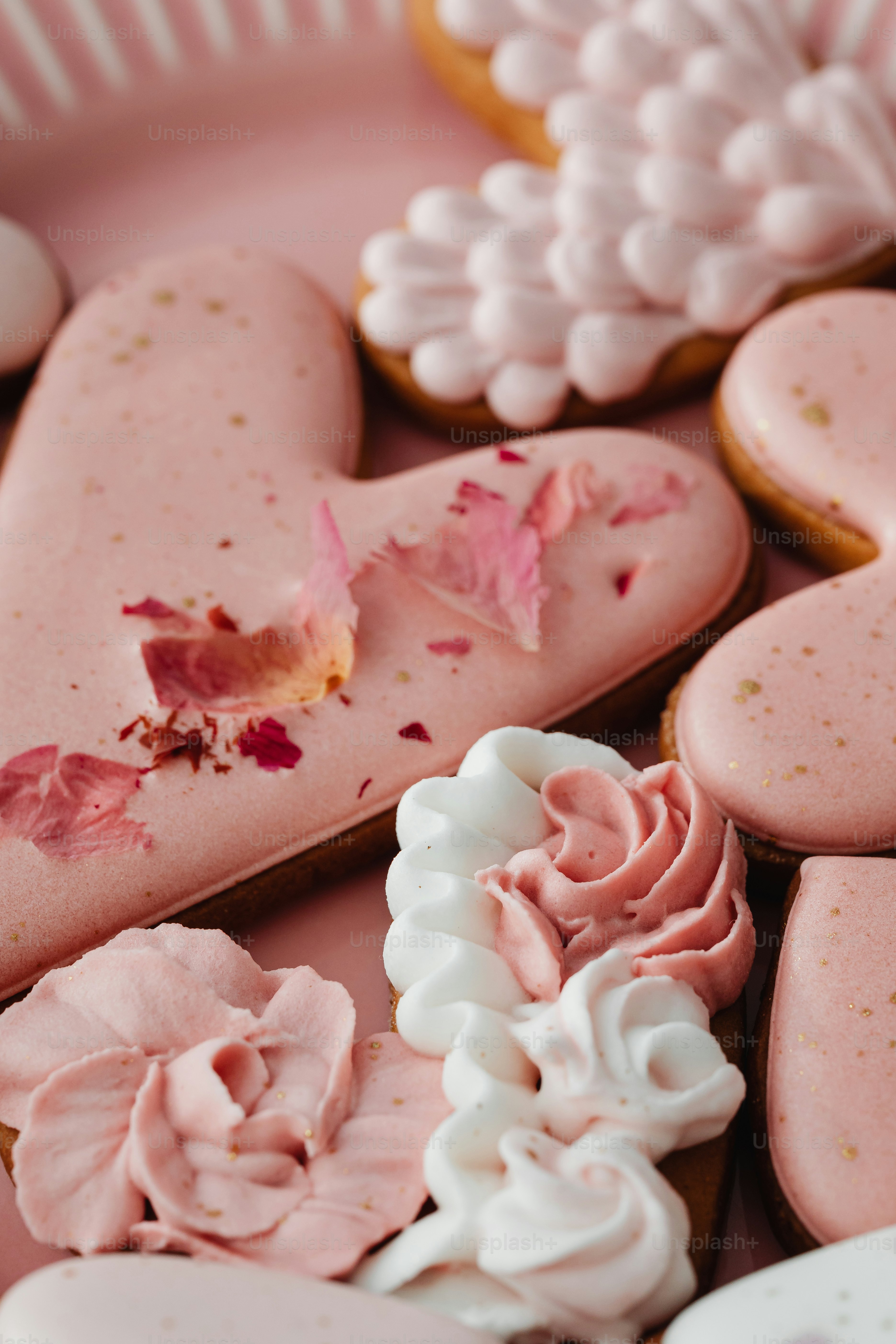 a close up of a plate of heart shaped cookies