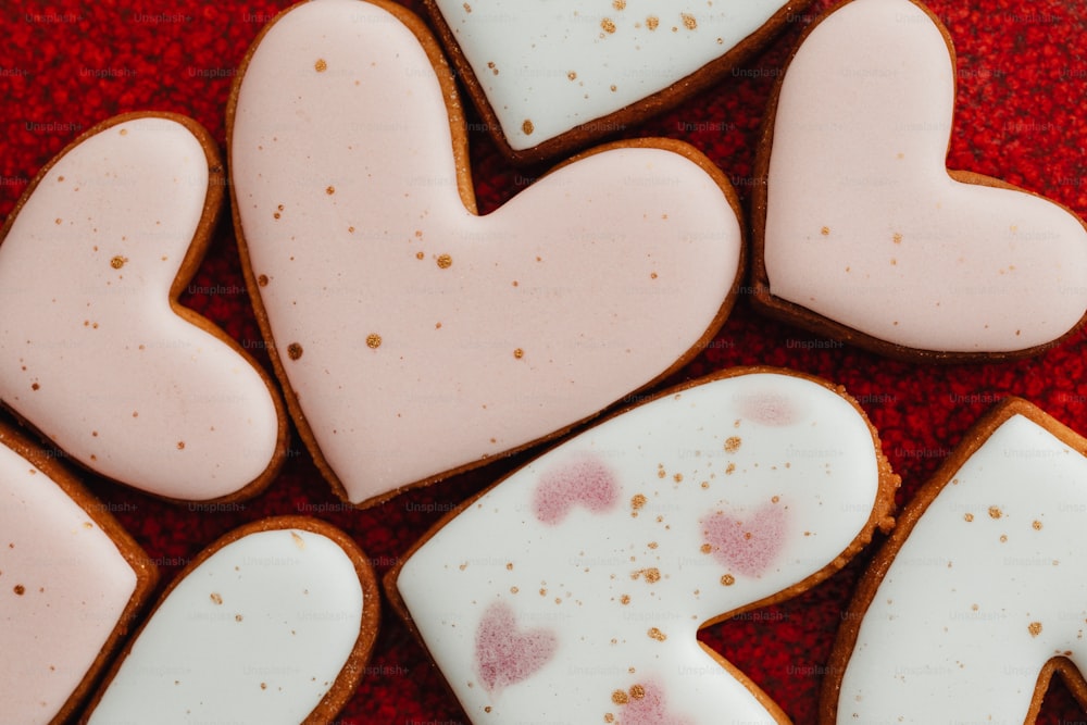 a close up of some heart shaped cookies