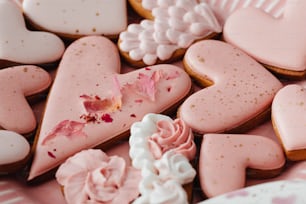 a close up of a plate of heart shaped cookies