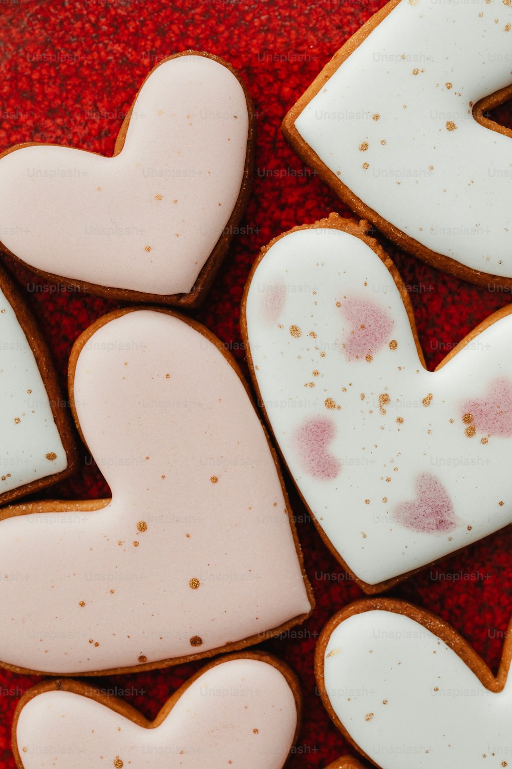 a close up of some heart shaped cookies