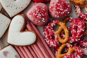 a close up of a plate of heart shaped cookies