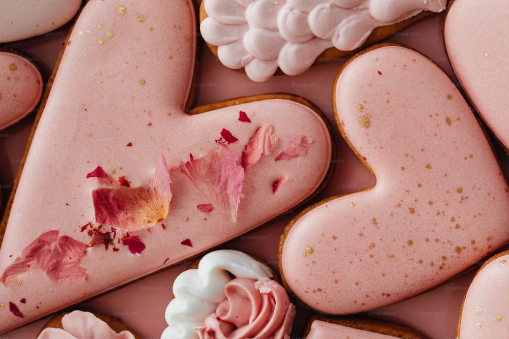 a close up of some heart shaped cookies