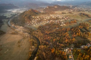 an aerial view of a town surrounded by mountains