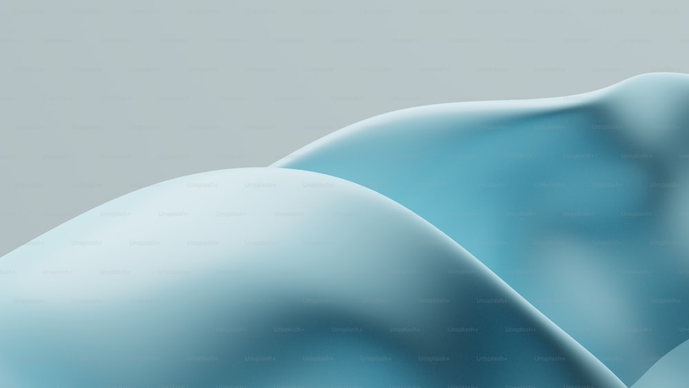 a close up of a blue object with a gray background