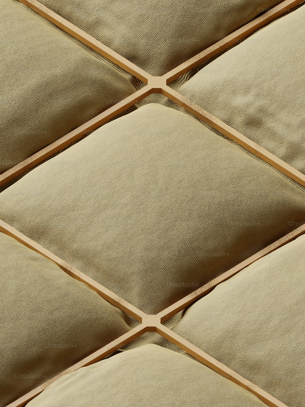 a close up view of a beige pillow